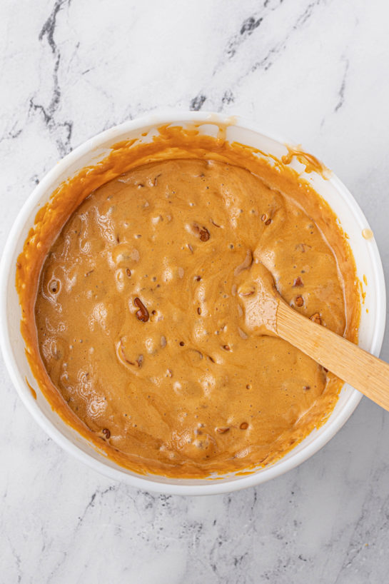 Mixing together the ingredients needed to make the Microwave Peanut Brittle recipe