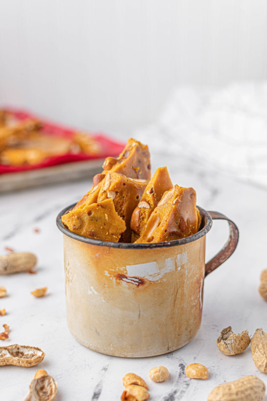 Photo of the completed Microwave Peanut Brittle recipe shown in a mug