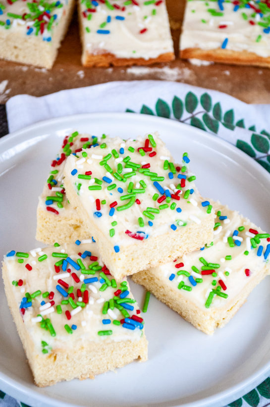 Overhead shot of the Holiday Sugar Cookie Bars cut up and on a plate for serving for Christmas or any holiday