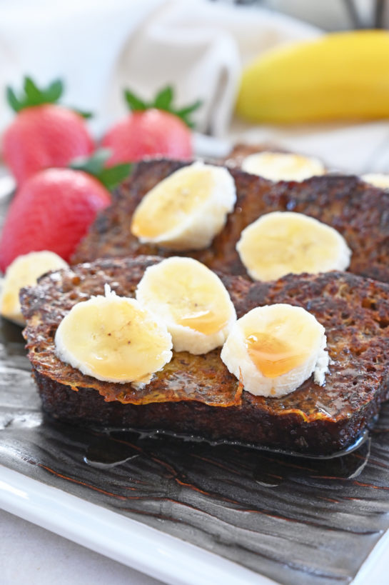 Easy Banana Bread French Toast recipe is a great breakfast for preparing ahead and it’s loaded with banana flavor! No need to wait for the weekend to enjoy French toast when you can cook up this irresistible banana breakfast quickly!