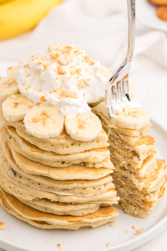 Close up of eating the Banana Pudding Pancakes that are flavorful enough you don't even need the syrup! They are a quick and easy breakfast or brunch recipe you will love!