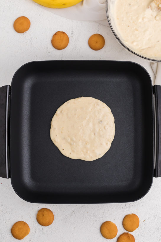 Pouring the batter on the griddle for the banana pudding pancakes recipe