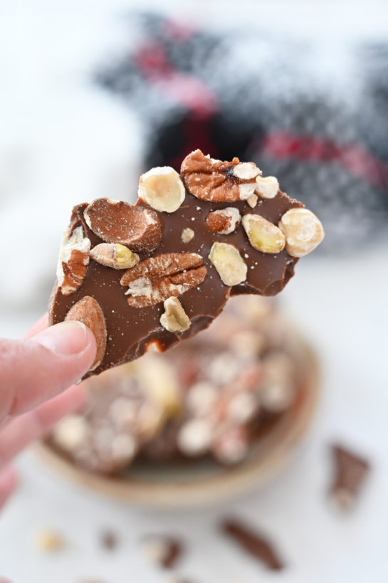 Close-up of 5-ingredient Salted Chocolate Almond Hazelnut Bark recipe is a beautiful, festive special occasion or holiday dessert that makes for a great edible Christmas gift for family, co-workers, and friends!