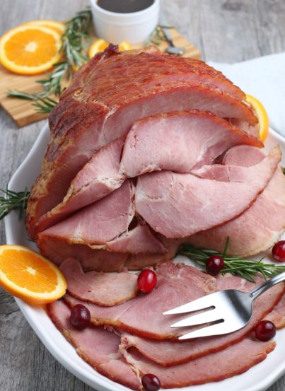 This recipe for Glazed Spiral Ham with a sweet glaze uses a fully-cooked ham and is a great centerpiece for your Christmas, Easter, or Thanksgiving dinner table! The flavor and texture will be a show-stopper!