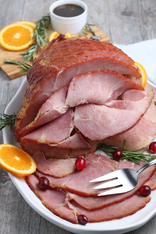 This recipe for Glazed Spiral Ham with a sweet glaze uses a fully-cooked ham and is a great centerpiece for your Christmas, Easter, or Thanksgiving dinner table! The flavor and texture will be a show-stopper!