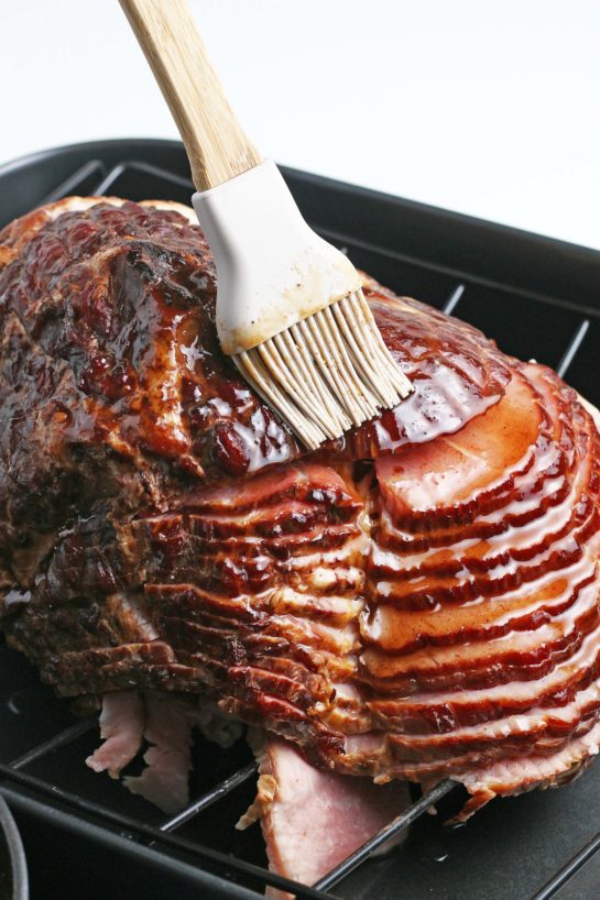 Brushing the glaze on the recipe for Glazed Spiral Ham 