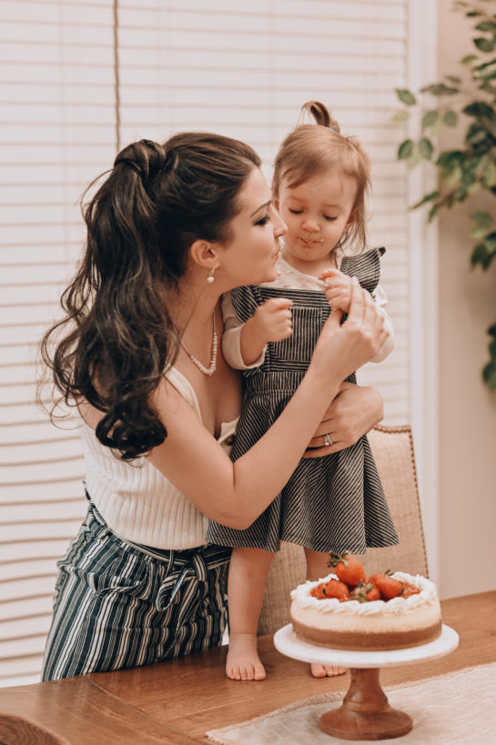 Taste-testing the New York-Style Cheesecake recipe with my daughter