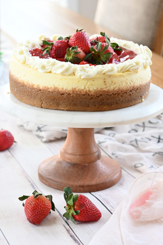 Topping the Strawberry Topped New York-Style Cheesecake recipe with the strawberries