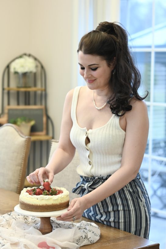 Topping the Strawberry Topped New York-Style Cheesecake recipe with the strawberries