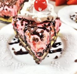 Close-up shot of a slice of the no-bake banana split cheesecake recipe for a birthday party or 4th of July
