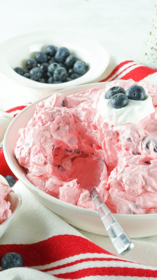 Serving and scooping the Patriotic Red White and Blue Fluff Salad recipe 