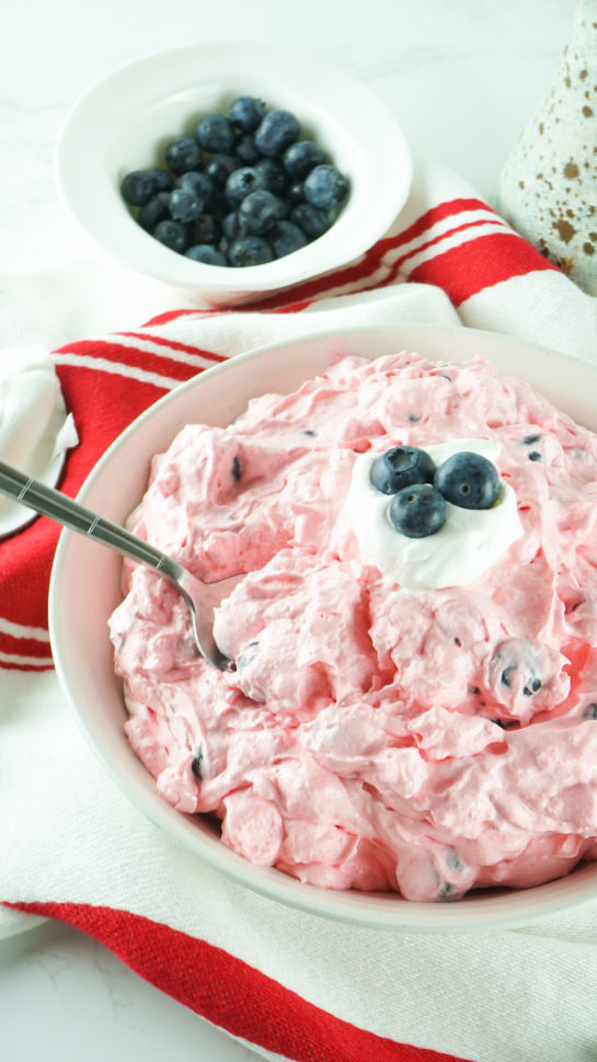 Red White and Blue Fluff Salad recipe is a delicious dump and go dessert salad or side dish idea that is perfect for any and all occasions! This is such an easy dessert to bring to parties, picnics, and potlucks. 