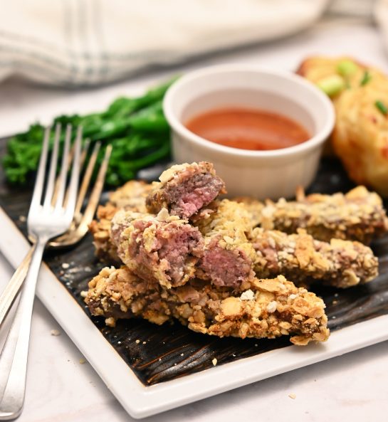 These golden and crispy deep-fried finger steaks recipe is what happens when chicken-fried steak meets chicken fingers but in BEEF form. You can dip them in my homemade "Country Sweet Sauce", cocktail sauce, or basic ranch dressing!