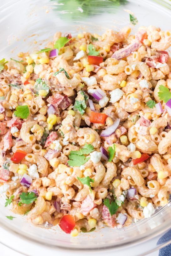 Close-up photo of Mexican Street Corn Pasta Salad is light and healthy, yet so delicious. It’s the perfect side or main dish for a big gathering or just a quick meal during the week with a Mexican twist!