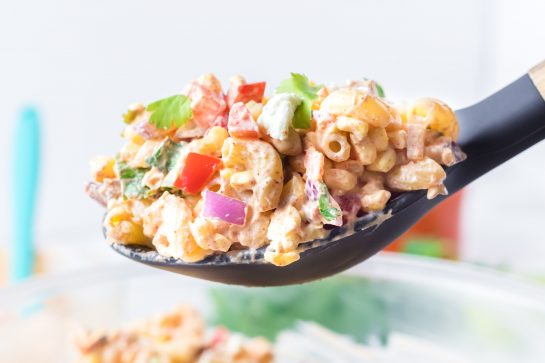Close-up shot of Mexican Street Corn Pasta Salad is light and healthy, yet so delicious. It’s the perfect side or main dish for a big gathering or just a quick dinner during the week with a Mexican twist!