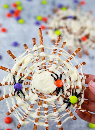 Halloween Chocolate Pretzel Spider Webs are fun sweet & salty dessert recipe to serve for a children's or adult Halloween party! They are easy to make and look fab on your party table!