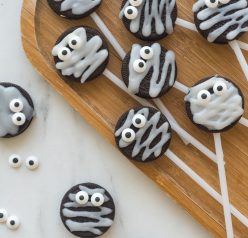 These Halloween Mummy Oreo Pops are adorable and so easy to make! With just a few ingredients and a fun time decorating, you will have these super cute treats that kids will love!