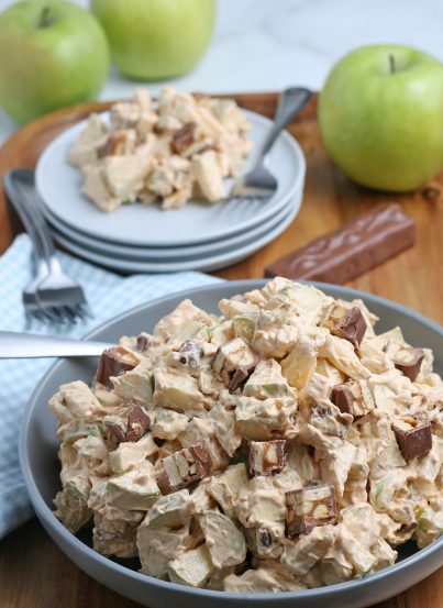 Caramel Apple Snickers Salad is a delicious side dish recipe with crunchy green apples, marshmallows, and Snickers candy bars as the main ingredients! Perfect for holidays and potlucks!