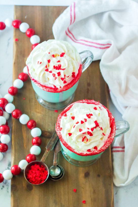 Ready to serve Grinch Hot Chocolate recipe is the perfect combination of creamy, smooth hot chocolate and green Grinch fun for Christmas. Kids and adults will love it!