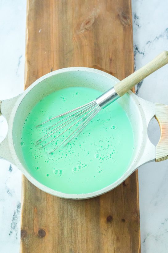 Melting the chocolate needed to make the Grinch Hot Chocolate recipe for Christmas holiday