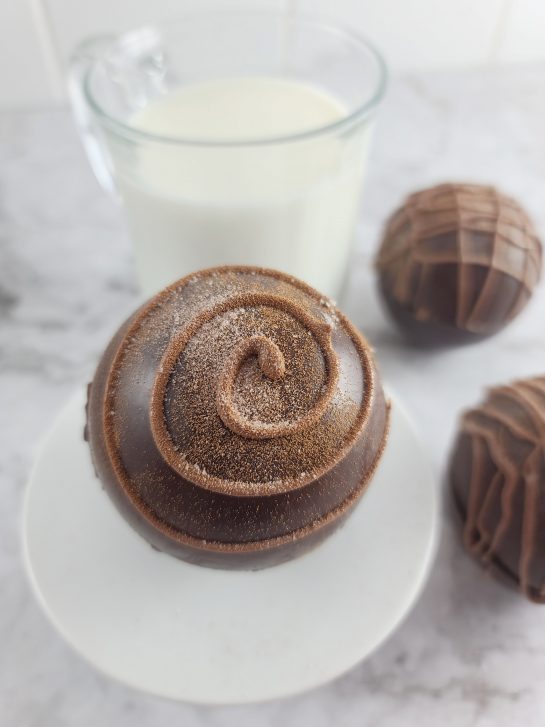 These Mocha Hot Chocolate Bombs with coffee flavor are all the rage this holiday season! Make this recipe ahead of time as an edible holiday gift, fulfill a chocolate craving, or a holiday dessert tray addition.