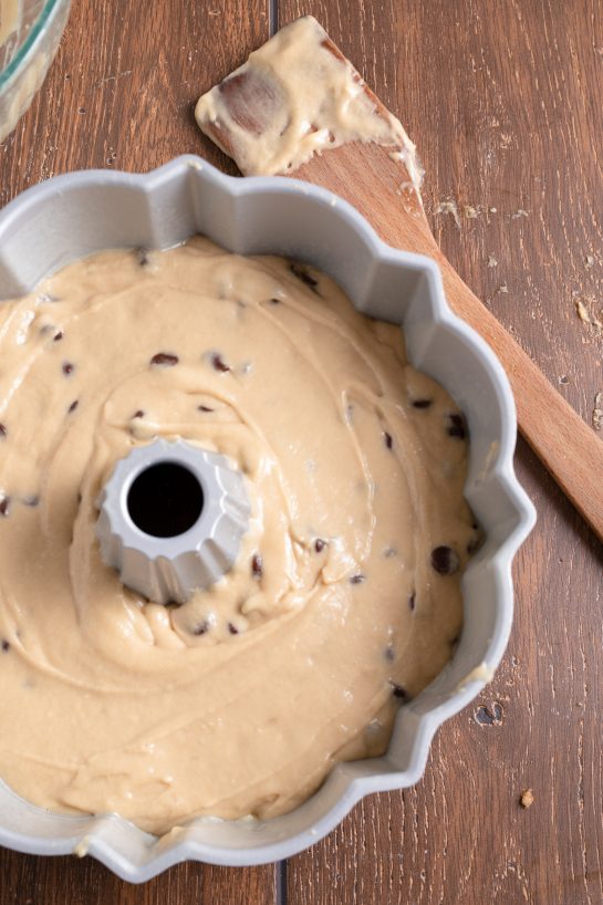 The batter in the bundt cake pan ready to bake the Peanut Butter Chocolate Chip Bundt Cake recipe