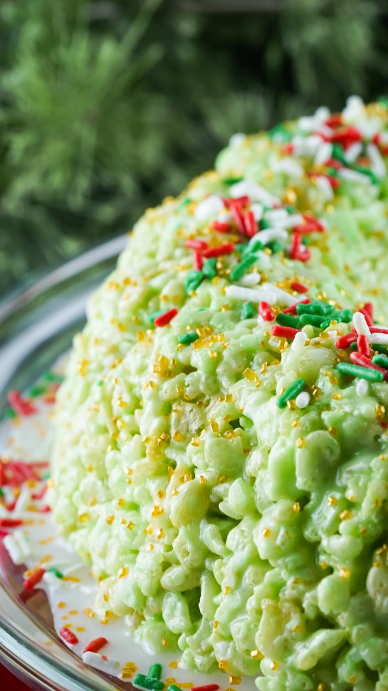 Close-up of the Rice Krispies Treats Wreath Cake is a super easy Christmas dessert recipe and is so much fun to make and enjoy. You will enjoy putting this together and sharing with your family and friends!
