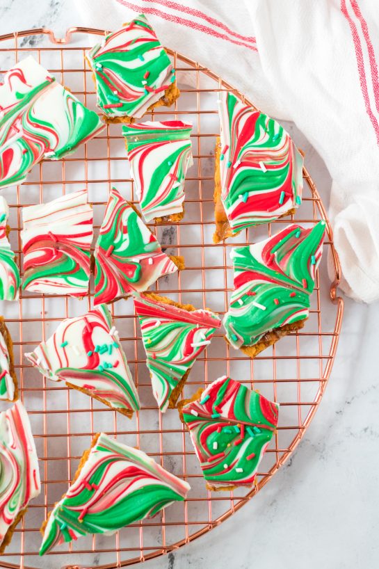 Christmas Ritz Cracker Candy recipe is a quick stovetop toffee poured over buttery Ritz crackers, coated in chocolate and topped with sprinkles. Once cooled, it is cracked into chunks and ready to be served for Christmas!