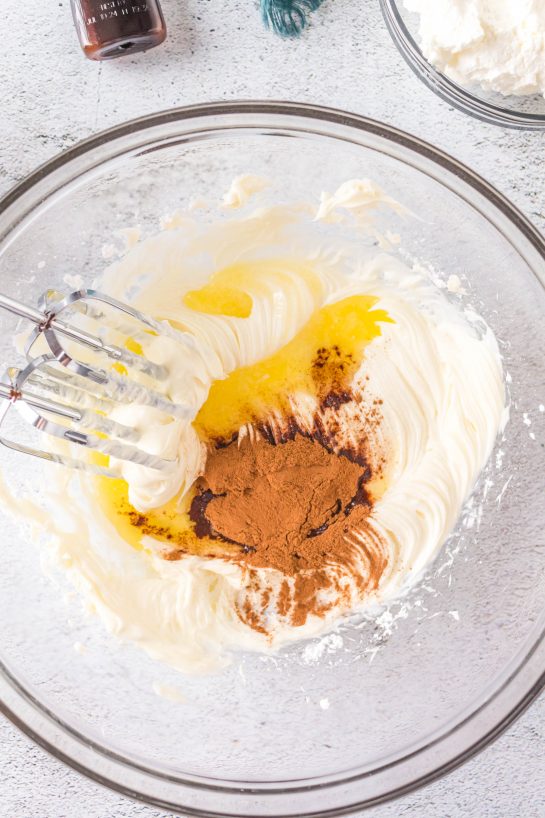 Ingredients being mixed to make this easy Cinnamon Roll Dip recipe