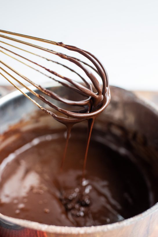 The chocolate ganache for the Peanut Butter Thumbprint Cookies recipe 