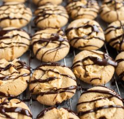 We are finished drizzling the chocolate ganache for the Peanut Butter Thumbprint Cookies recipe