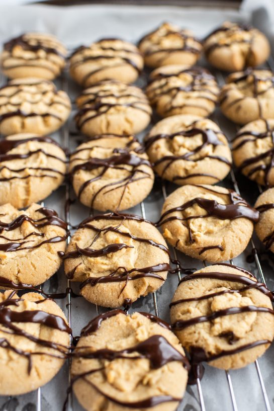 We are finished drizzling the chocolate ganache for the Peanut Butter Thumbprint Cookies recipe 
