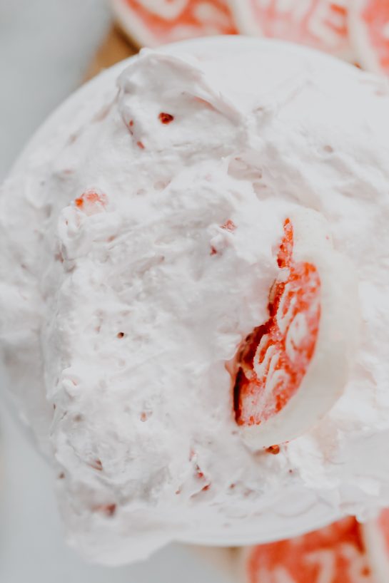 Close-up of Strawberry Cake Mix Dip is one of the first dessert dip recipes I fell in love with as a child and I can never get enough of it. All you need is three simple ingredients and it's perfect for Valentine's Day!