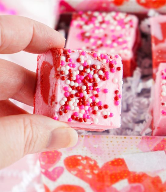 Beautiful Layered Valentine's Day Strawberry Fudge recipe requires just four simple ingredients and can be made in under 10 minutes! Pretty and cute gift for your Valentine.