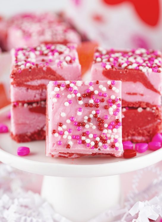 Easy Layered Valentine's Day Strawberry Fudge recipe requires just four ingredients and can be made in under 10 minutes! Pretty and cute gift for your Valentine.