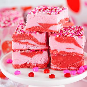 Layered Valentine's Day Strawberry Fudge recipe requires just four ingredients and can be made in under 10 minutes! Pretty and super cute gift for your Valentine.