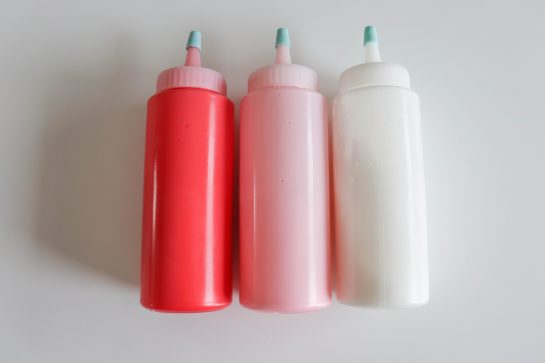 Photo of the icing bottles of the easy sugar cookie royal icing recipe for the sugar cookies for any holiday or party