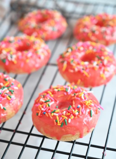 Vanilla-Glazed Baked Donuts is an easy recipe to give you familiar, old-fashioned dessert without all the hassle of rolling, cutting, and frying the dough. These donuts will remind you just how delicious breakfast or brunch can be!