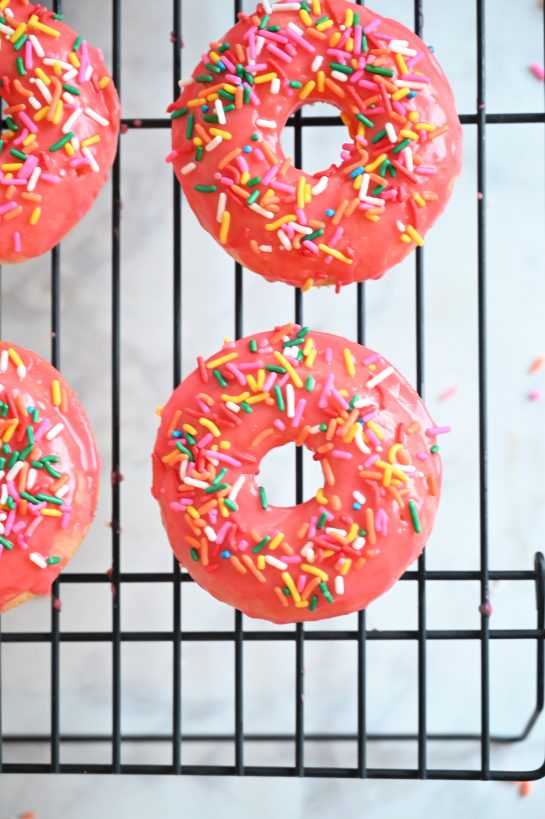 Vanilla-Glazed Baked Donuts is an easy recipe to give you familiar, old-fashioned dessert without all the hassle of rolling, cutting, and frying the dough. These donuts will remind you just how delicious breakfast or a dessert can be!