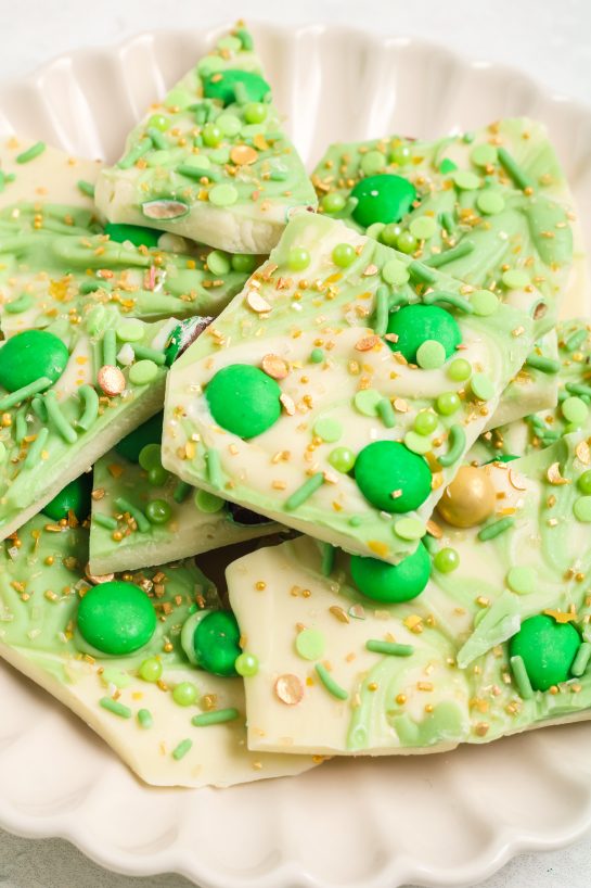 Leprechaun Bark candy recipe is loaded with colorful and green, festive toppings. It’s a different flavor and texture in every bite, tastes great, and is perfect for St. Patrick's Day!