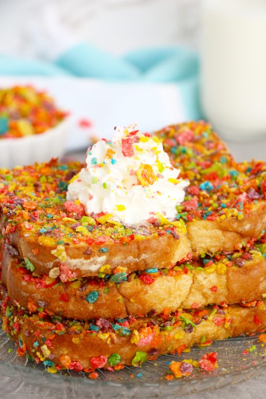 Easy Air Fryer Fruity Pebble French Toast is a classic French toast recipe made with a sweet and crispy cereal coating right in the air fryer. This Fruity Pebbles French toast is a fun twist on a favorite breakfast or brunch!