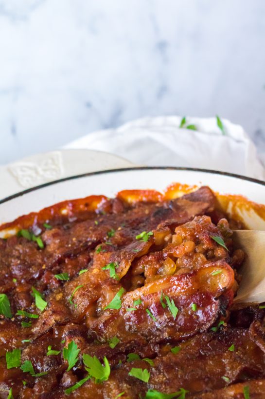 Beefy Baked Beans are my favorite!! Beans get mixed with ground beef, onion and bell pepper, brown sugar, ketchup, mustard and Worcestershire before getting topped with a crispy, peppered brown sugar bacon.