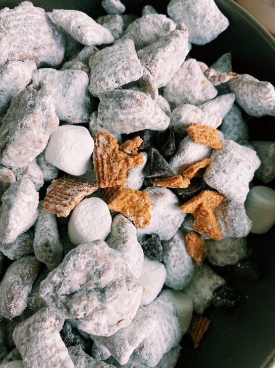 This S'mores Puppy Chow is perfect for snacking, potlucks, and so easy for on the go. There's something about the pairing of melted chocolate and marshmallows in addition to a hint of honey graham crackers that will really make your mouth water.
