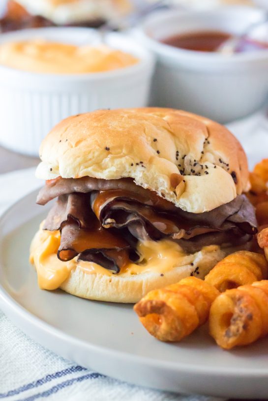 These Copycat Arbys Beef & Cheddars are the best copycat recipe!  They taste just like the real thing except you get to skip the drive thru and it’s faster!  Onion buns, roast beef, cheddar sauce and the secret red sauce (French dressing) make these sandwiches come together in minutes!
