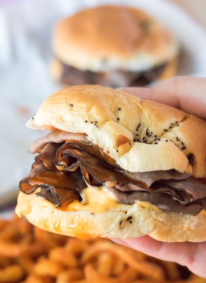 These Copycat Arbys Beef & Cheddars are the ultimate copycat recipe!  They taste just like the real thing except you get to skip the drive thru and it’s faster!  Onion buns, roast beef, cheddar sauce and the secret red sauce (French dressing) make these sandwiches come together in minutes!