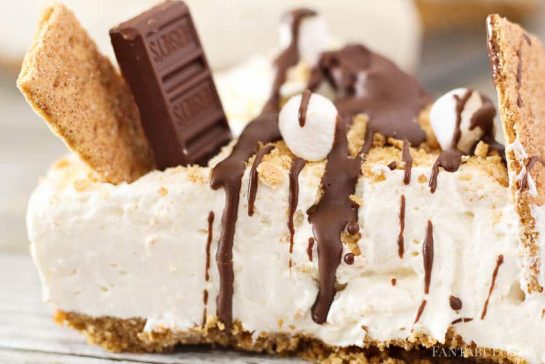 This s'mores cheesecake is a no bake dessert that combines two favorite classics! This no-bake s’mores cheesecake recipe is an easy dessert that is made using ingredients of your favorite fireside treat!
