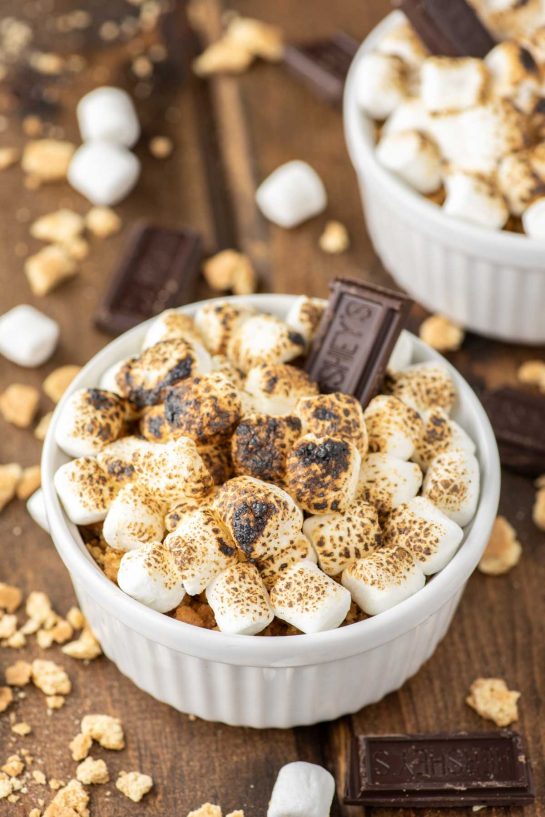 This s'mores crème brûlée consists of a chocolate custard topped with crushed graham crackers and toasted marshmallows, bringing back those wonderful campfire memories.