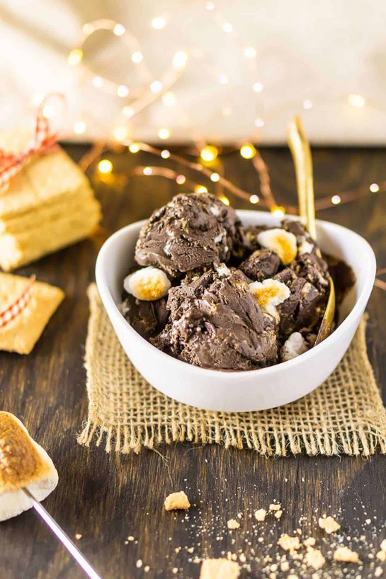Featuring a decadent chocolate base, this s’mores ice cream is studded with crushed graham cracker and toasted marshmallows for one crowd-pleasing summer dessert.