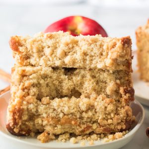 This easy Apple Streusel Coffee Cake fall dessert recipe just perfect for Fall! This soft, moist cake is easy to make because it starts with a box mix that you jazz up with apples, cinnamon and a crunchy streusel topping. 