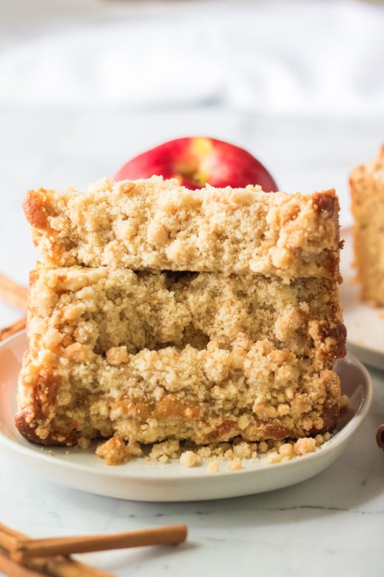 This easy Apple Streusel Coffee Cake fall dessert recipe just perfect for Fall! This soft, moist cake is easy to make because it starts with a box mix that you jazz up with apples, cinnamon and a crunchy streusel topping. 